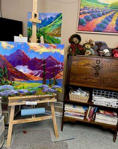 Dawn Scott's art studio with painting on easel.